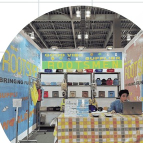 The ROOTSMEN stand with its product wall and meeting table